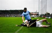 19 April 2025; Offaly goalkeeper Mark Troy is tackled by Danny Sutcliffe of Dublin during the Leinster GAA Hurling Senior Championship Round 1 match between Dublin and Offaly at Parnell Park in Dublin. Photo by Ray McManus/Sportsfile