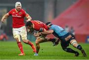19 April 2025; Lee Barron of Munster is tackled by Marcell Coetzee of Vodacom Bulls during the United Rugby Championship match between Munster and Vodacom Bulls at Thomond Park in Limerick. Photo by David Fitzgerald/Sportsfile