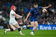 19 April 2025; Michael Lowry of Ulster makes a pass despite the attention of Jimmy O'Brien of Leinster during the United Rugby Championship match between Leinster and Ulster at the Aviva Stadium in Dublin. Photo by Brendan Moran/Sportsfile