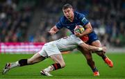 19 April 2025; Scott Penny of Leinster is tackled by Michael Lowry of Ulster during the United Rugby Championship match between Leinster and Ulster at the Aviva Stadium in Dublin. Photo by Brendan Moran/Sportsfile