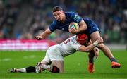19 April 2025; Scott Penny of Leinster is tackled by Michael Lowry of Ulster during the United Rugby Championship match between Leinster and Ulster at the Aviva Stadium in Dublin. Photo by Brendan Moran/Sportsfile