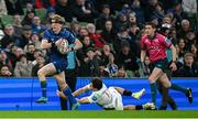 19 April 2025; Tommy O'Brien of Leinster evades the tackle of on his way to scoring his side's first try during the United Rugby Championship match between Leinster and Ulster at the Aviva Stadium in Dublin. Photo by Brendan Moran/Sportsfile