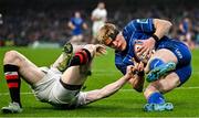 19 April 2025; Tommy O’Brien of Leinster scores his side's first try despite the efforts of Nathan Doak of Ulster during the United Rugby Championship match between Leinster and Ulster at the Aviva Stadium in Dublin. Photo by Sam Barnes/Sportsfile