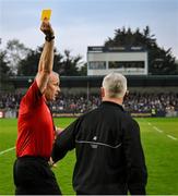 19 April 2025; Referee Johnny Murphy issues a yellow card to Offaly manager Johnny Kelly late in the Leinster GAA Hurling Senior Championship Round 1 match between Dublin and Offaly at Parnell Park in Dublin. Photo by Ray McManus/Sportsfile