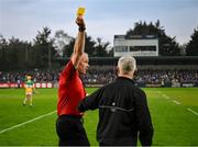 19 April 2025; Referee Johnny Murphy issues a yellow card to Offaly manager Johnny Kelly late in the Leinster GAA Hurling Senior Championship Round 1 match between Dublin and Offaly at Parnell Park in Dublin. Photo by Ray McManus/Sportsfile