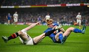 19 April 2025; Tommy O’Brien of Leinster scores his side's first try despite the efforts of Nathan Doak of Ulster during the United Rugby Championship match between Leinster and Ulster at the Aviva Stadium in Dublin. Photo by Sam Barnes/Sportsfile