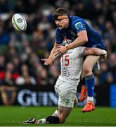 19 April 2025; Garry Ringrose of Leinster is tackled by Michael Lowry of Ulster during the United Rugby Championship match between Leinster and Ulster at the Aviva Stadium in Dublin. Photo by Sam Barnes/Sportsfile