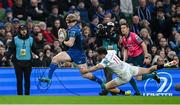 19 April 2025; Tommy O'Brien of Leinster evades the tackle of Jacob Stockdale of Ulster on his way to scoring his side's first try during the United Rugby Championship match between Leinster and Ulster at the Aviva Stadium in Dublin. Photo by Brendan Moran/Sportsfile