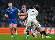 19 April 2025; Ciarán Frawley of Leinster is tackled by David McCann of Ulster during the United Rugby Championship match between Leinster and Ulster at the Aviva Stadium in Dublin. Photo by Brendan Moran/Sportsfile