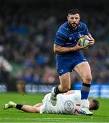 19 April 2025; Robbie Henshaw of Leinster evades the tackle of Stewart Moore of Ulster during the United Rugby Championship match between Leinster and Ulster at the Aviva Stadium in Dublin. Photo by Brendan Moran/Sportsfile