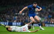 19 April 2025; Robbie Henshaw of Leinster evades the tackle of Stewart Moore of Ulster during the United Rugby Championship match between Leinster and Ulster at the Aviva Stadium in Dublin. Photo by Brendan Moran/Sportsfile