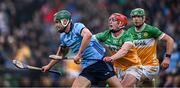 19 April 2025; Chris Crummey of Dublin prepares to clear under pressure from Offaly players Charlie Mitchell and Brian Duignan, 14, during the Leinster GAA Hurling Senior Championship Round 1 match between Dublin and Offaly at Parnell Park in Dublin. Photo by Ray McManus/Sportsfile