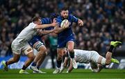 19 April 2025; Robbie Henshaw of Leinster is tackled by Ulster players Stewart Moore, left, and Nick Timoney during the United Rugby Championship match between Leinster and Ulster at the Aviva Stadium in Dublin. Photo by Sam Barnes/Sportsfile