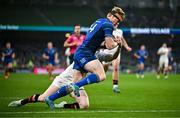 19 April 2025; Tommy O'Brien of Leinster evades the tackle of Nathan Doak of Ulster on his way to scoring his side's first try during the United Rugby Championship match between Leinster and Ulster at the Aviva Stadium in Dublin. Photo by Sam Barnes/Sportsfile