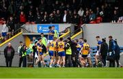 19 April 2025; Players from both sides get involved in a tussle on their way to the dressing rooms for half-time during the Munster GAA Football Senior Championship semi-final match between Clare and Tipperary at Zimmer Biomet Cusack Park in Ennis, Clare. Photo by Tom Beary/Sportsfile