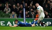 19 April 2025; Garry Ringrose of Leinster scores his side's fourth try despite the attention of Nathan Doak of Ulster during the United Rugby Championship match between Leinster and Ulster at the Aviva Stadium in Dublin. Photo by Sam Barnes/Sportsfile