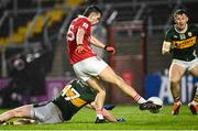 19 April 2025; Chris Óg Jones of Cork shoots to score his side's first goal, under pressure from Tadhg Morley of Kerry, during the Munster GAA Football Senior Championship semi-final match between Cork and Kerry at Supervalu Páirc Uí Chaoimh in Cork. Photo by Piaras Ó Mídheach/Sportsfile