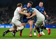 19 April 2025; Scott Penny of Leinster is tackled by Ulster players Callum Reid, left, and James McNabney during the United Rugby Championship match between Leinster and Ulster at the Aviva Stadium in Dublin. Photo by Brendan Moran/Sportsfile
