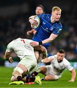 19 April 2025; Jamie Osborne of Leinster is tackled by Nick Timoney of Ulster during the United Rugby Championship match between Leinster and Ulster at the Aviva Stadium in Dublin. Photo by Brendan Moran/Sportsfile