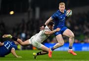 19 April 2025; Jamie Osborne of Leinster evades the tackle of Jacob Stockdale of Ulster during the United Rugby Championship match between Leinster and Ulster at the Aviva Stadium in Dublin. Photo by Brendan Moran/Sportsfile