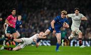 19 April 2025; Tommy O'Brien of Leinster is tackled by Nathan Doak of Ulster during the United Rugby Championship match between Leinster and Ulster at the Aviva Stadium in Dublin. Photo by Brendan Moran/Sportsfile