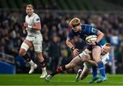 19 April 2025; Tommy O'Brien of Leinster is tackled by Nathan Doak of Ulster during the United Rugby Championship match between Leinster and Ulster at the Aviva Stadium in Dublin. Photo by Sam Barnes/Sportsfile