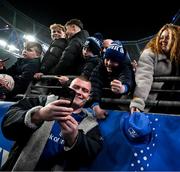 19 April 2025; Jack Boyle of Leinster takes selfies with supporters after his side's victory in the United Rugby Championship match between Leinster and Ulster at the Aviva Stadium in Dublin. Photo by Brendan Moran/Sportsfile