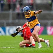 20 April 2025; Clare Hehir of Clare in action against Amy O'Connor of Cork during the Munster Senior Camogie Championship semi-final match between Clare and Cork at Zimmer Biomet Páirc Chíosóg in Ennis, Clare. Photo by Brendan Moran/Sportsfile