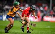 20 April 2025; Amy O'Connor of Cork in action against Susan Daly of Clare during the Munster Senior Camogie Championship semi-final match between Clare and Cork at Zimmer Biomet Páirc Chíosóg in Ennis, Clare. Photo by Brendan Moran/Sportsfile