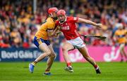 20 April 2025; Brian Hayes of Cork is tackled by Darragh Lohan of Clare during the Munster GAA Hurling Senior Championship Round 1 match between Clare and Cork at Zimmer Biomet Páirc Chíosóg in Ennis, Clare. Photo by Brendan Moran/Sportsfile