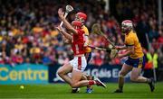 20 April 2025; Brian Hayes of Cork is tackled by Darragh Lohan of Clare during the Munster GAA Hurling Senior Championship Round 1 match between Clare and Cork at Zimmer Biomet Páirc Chíosóg in Ennis, Clare. Photo by Brendan Moran/Sportsfile