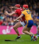 20 April 2025; Brian Hayes of Cork is tackled by Darragh Lohan of Clare during the Munster GAA Hurling Senior Championship Round 1 match between Clare and Cork at Zimmer Biomet Páirc Chíosóg in Ennis, Clare. Photo by Brendan Moran/Sportsfile