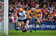 20 April 2025; Brian Hayes of Cork scores his side's first goal past Clare goalkeeper Eibhear Quilligan and Clare players Conor Leen and Darragh Lohan during the Munster GAA Hurling Senior Championship Round 1 match between Clare and Cork at Zimmer Biomet Páirc Chíosóg in Ennis, Clare. Photo by Brendan Moran/Sportsfile