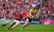 20 April 2025; Aidan McCarthy of Clare in action against Seán O’Donoghue of Cork during the Munster GAA Hurling Senior Championship Round 1 match between Clare and Cork at Zimmer Biomet Páirc Chíosóg in Ennis, Clare. Photo by Brendan Moran/Sportsfile