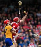 20 April 2025; Brian Hayes of Cork in action against Darragh Lohan of Clare during the Munster GAA Hurling Senior Championship Round 1 match between Clare and Cork at Zimmer Biomet Páirc Chíosóg in Ennis, Clare. Photo by Brendan Moran/Sportsfile