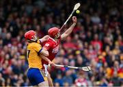 20 April 2025; Brian Hayes of Cork in action against Darragh Lohan of Clare during the Munster GAA Hurling Senior Championship Round 1 match between Clare and Cork at Zimmer Biomet Páirc Chíosóg in Ennis, Clare. Photo by Brendan Moran/Sportsfile