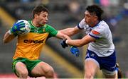 20 April 2025; Conor O'Donnell of Donegal in action against Gary Mohan of Monaghan during the Ulster GAA Football Senior Championship quarter-final match between Monaghan and Donegal at St Tiernach's Park in Clones, Monaghan. Photo by Ramsey Cardy/Sportsfile