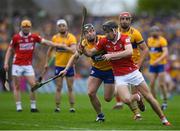20 April 2025; Tony Kelly of Clare  in action against Eoin Downey of Cork during the Munster GAA Hurling Senior Championship Round 1 match between Clare and Cork at Zimmer Biomet Páirc Chíosóg in Ennis, Clare. Photo by John Sheridan/Sportsfile