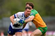 20 April 2025; Ryan Wylie of Monaghan in action against Shane O'Donnell of Donegal during the Ulster GAA Football Senior Championship quarter-final match between Monaghan and Donegal at St Tiernach's Park in Clones, Monaghan. Photo by Ramsey Cardy/Sportsfile
