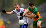 20 April 2025; Jack McCarron of Monaghan in action against Finnbarr Roarty of Donegal during the Ulster GAA Football Senior Championship quarter-final match between Monaghan and Donegal at St Tiernach's Park in Clones, Monaghan. Photo by Ramsey Cardy/Sportsfile
