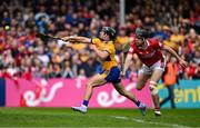 20 April 2025; David Reidy of Clare scores his side's second goal despite the challenge of Robert Downey of Cork during the Munster GAA Hurling Senior Championship Round 1 match between Clare and Cork at Zimmer Biomet Páirc Chíosóg in Ennis, Clare. Photo by Brendan Moran/Sportsfile