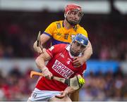 20 April 2025; Seán O’Donoghue of Cork in action against Peter Duggan of Clare during the Munster GAA Hurling Senior Championship Round 1 match between Clare and Cork at Zimmer Biomet Páirc Chíosóg in Ennis, Clare. Photo by John Sheridan/Sportsfile