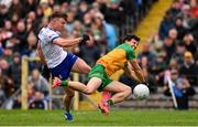 20 April 2025; Conor McCarthy of Monaghan has a shot at goal blocked by Finnbarr Roarty of Donegal during the Ulster GAA Football Senior Championship quarter-final match between Monaghan and Donegal at St Tiernach's Park in Clones, Monaghan. Photo by Ramsey Cardy/Sportsfile