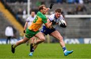 20 April 2025; Andrew Woods of Monaghan in action against Stephen McMenamin of Donegal during the Ulster GAA Football Senior Championship quarter-final match between Monaghan and Donegal at St Tiernach's Park in Clones, Monaghan. Photo by Ramsey Cardy/Sportsfile