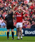 20 April 2025; Shane Barrett of Cork is shown a red card by referee Liam Gordon during the Munster GAA Hurling Senior Championship Round 1 match between Clare and Cork at Zimmer Biomet Páirc Chíosóg in Ennis, Clare. Photo by Brendan Moran/Sportsfile