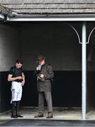 20 April 2025; Trainer Willie Mullins, right, and jockey Paul Townend find a moment's peace in a stable during day two of the Fairyhouse Easter Festival at Fairyhouse Racecourse in Ratoath, Meath. Photo by Shauna Clinton/Sportsfile