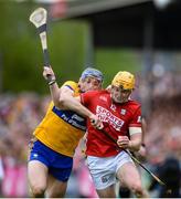 20 April 2025; Shane Barrett of Cork in action against David McInerney of Clare during the Munster GAA Hurling Senior Championship Round 1 match between Clare and Cork at Zimmer Biomet Páirc Chíosóg in Ennis, Clare. Photo by John Sheridan/Sportsfile