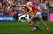 20 April 2025; Ryan Taylor of Clare tries to pull away from Tim O'Mahony of Cork during the Munster GAA Hurling Senior Championship Round 1 match between Clare and Cork at Zimmer Biomet Páirc Chíosóg in Ennis, Clare. Photo by John Sheridan/Sportsfile
