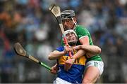 20 April 2025; Craig Morgan of Tipperary is tackled by Gearoid Hegarty of Limerick during the Munster GAA Hurling Senior Championship Round 1 match between Tipperary and Limerick at FBD Semple Stadium in Thurles, Tipperary. Photo by Seb Daly/Sportsfile
