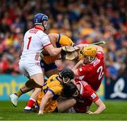 20 April 2025; Cork players Patrick Collins, Eoin Downey and Niall O'Leary clash with Clare players Mark Rodgers and Ian Galvin during the Munster GAA Hurling Senior Championship Round 1 match between Clare and Cork at Zimmer Biomet Páirc Chíosóg in Ennis, Clare. Photo by Brendan Moran/Sportsfile